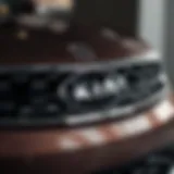 A close-up view of the sleek front grille of a modern Kia model