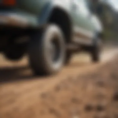 Truck Tires on Dirt Road A close-up of truck tires on a dirt road, highlighting durability