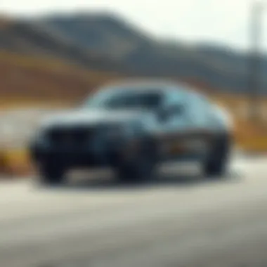 Thrilling Performance on the Open Road Dynamic performance shot of the 2021 BMW X6 M Sport on the road