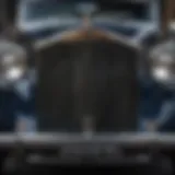 A close-up of the intricate grille design of a vintage Rolls Royce car showcasing its elegance.
