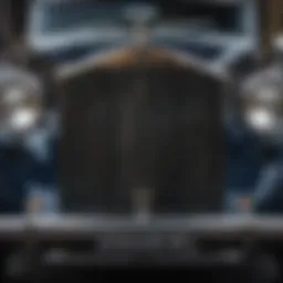 A close-up of the intricate grille design of a vintage Rolls Royce car showcasing its elegance.