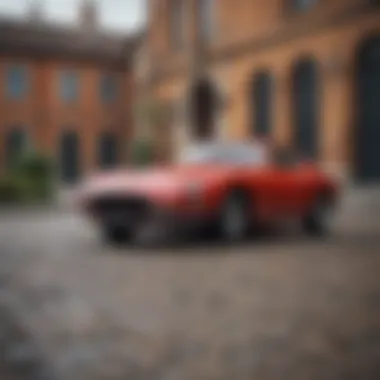 A classic granturismo model parked at a historic landmark