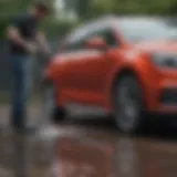 A high-pressure washer in action cleaning a car exterior