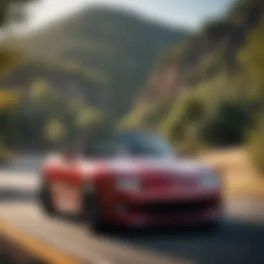 The First Mazda Miata on a Scenic Drive A scenic drive featuring the first Mazda Miata on a winding road.